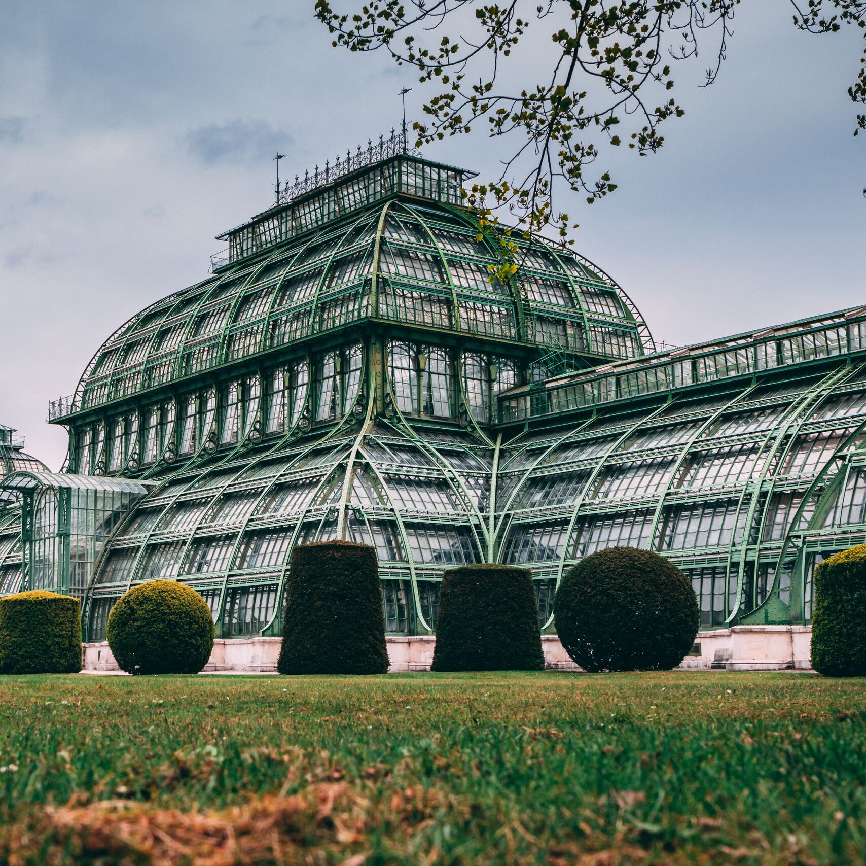 Stunning view of Vienna's Palmenhaus showcasing elegant glass and iron architecture.